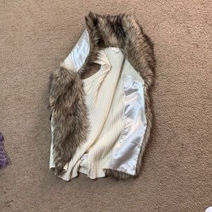 White with fur vest